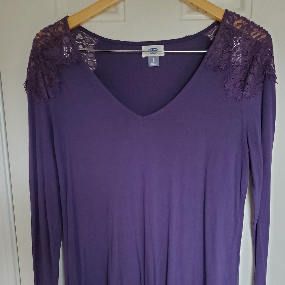 Long sleeve blouse with lace shoulder detail.